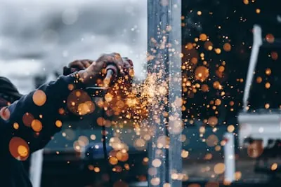 Welder at work with sparks flying